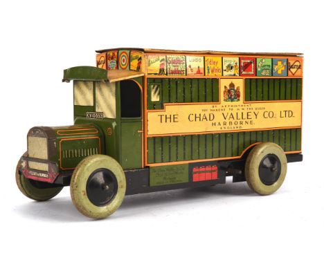 A Chad Valley Clockwork Tinplate Dennis Games Delivery Van CV 10032 in green "BY APPOINTMENT TOY MAKERS TO H.M. THE QUEEN THE