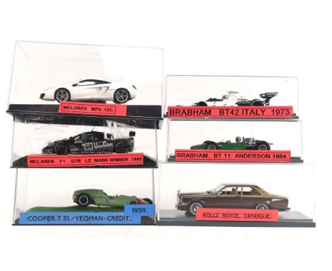 Twenty four 1:43 scale die-cast model cars including ; SMTS The Racing Line Cooper, 1973 Brabham BT42, Rolls Royce Carargue, 