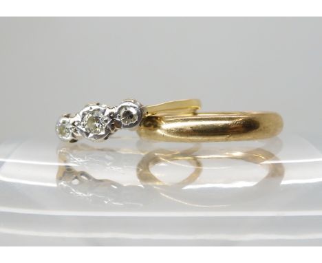 An 18ct gold three stone diamond ring set with estimated approx 0.20cts of diamonds, size S1/2, weight 2.3gms, together with 