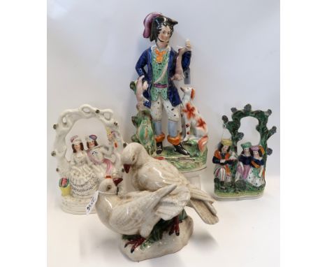 Three Staffordshire figure groups and an antiqued ceramic group of doves Condition Report: Available upon request