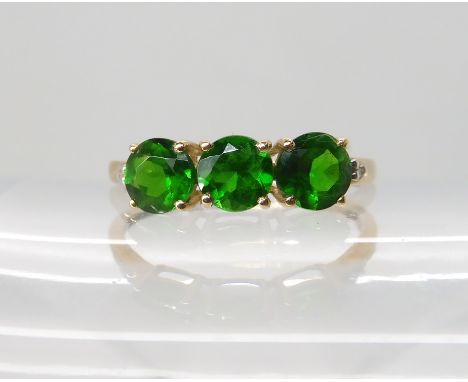 A 9ct gold Russian diopside and diamond ring size P1/2, weight 1.2gms Condition Report: Light general wear.