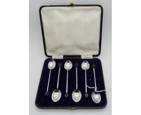 A cased set of six silver coffee bean spoons, Sheffield 1933 Condition Report: Available upon request