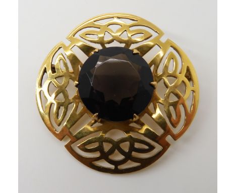 A 9ct gold Ward brothers Celtic knotwork brooch set with smoky quartz, diameter 3.8cm, weight 7.5gms Condition Report: Light 