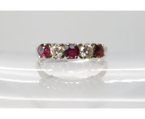 An 18ct white gold ruby and diamond ring set with estimated approx 0.18cts of brilliant cut diamonds combined, finger size M1