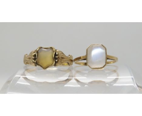 A yellow metal moonstone ring size K, together with a yellow metal agate set signet ring size P1/2, weight 3.5gms Condition R
