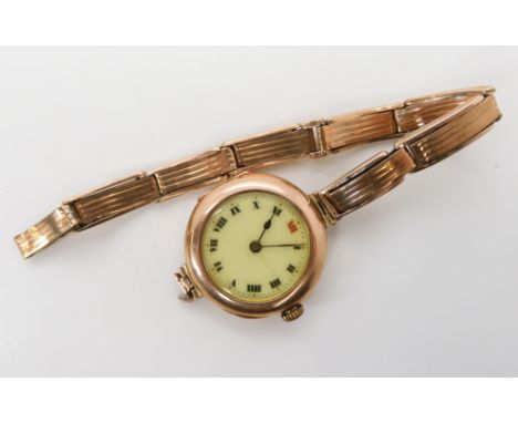 A 9ct gold ladies vintage Rolex and strap (af) weight including mechanism 23gms Condition Report: Winds and is ticking. Hairl