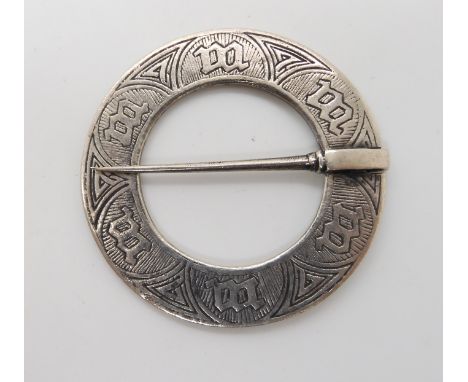 A silver Alexander Ritchie annular marriage brooch, with Glasgow hallmarks for 1928 and AR spectacle marks further stamped Io