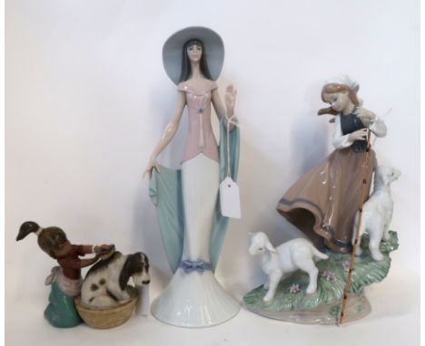 Three Lladro figures including a girl and lambs, 6964, a lady 6213 and another of a girl giving a dog a bath Condition Report