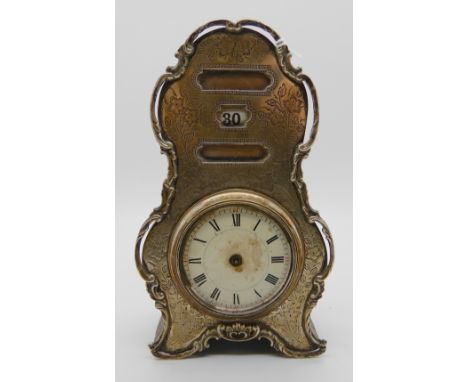 A silver mounted mantle clock (calendar), Birmingham 1906, 17cm high Condition Report: Available upon request