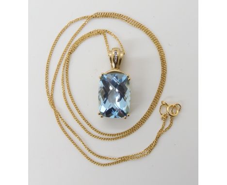 A 9ct gold checkerboard cut blue topaz and diamond accent pendant, length approx including bail 2.3cm and chain 45cm, weight 