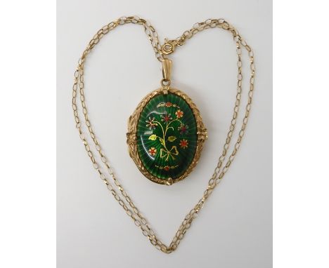 A 9ct gold guilloche enamelled locket and chain, dimensions of locket 4.2cm x 2.4cm, weight 11gms Condition Report: enamel; a