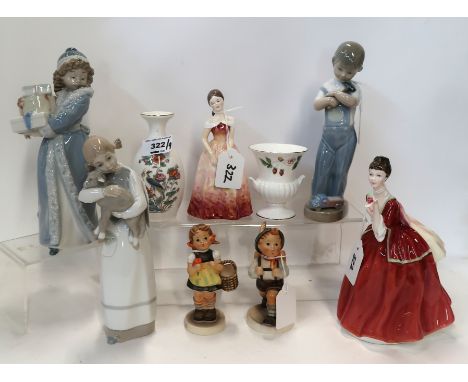 Two Hummel figures, two Lladro figures, a Nao figure, a Doulton figure Flower of Love, another figure and two Wedgwood vases 