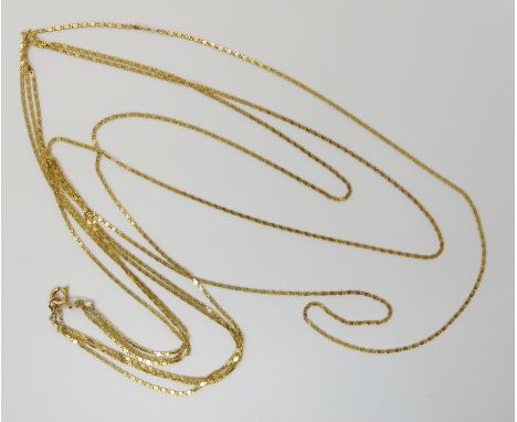 A 14k gold three strand fancy chain, length of shortest chain 57cm, weight 9.7gms Condition Report: Light general wear.