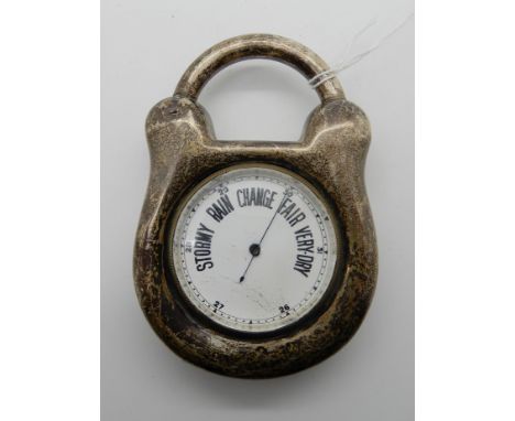 A silver cased barometer modelled as a padlock (rubbed marks) Condition Report: Can't tell if it is working, there is no move