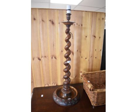 An early 20th Century and later mahogany torchere style lamp having twist column, height approx 77cm to fitting