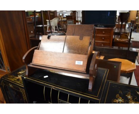 An early 20th Century oak stationery rack and a mahogany book trough