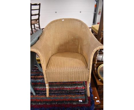 A Lloyd Loom tub chair, in beige