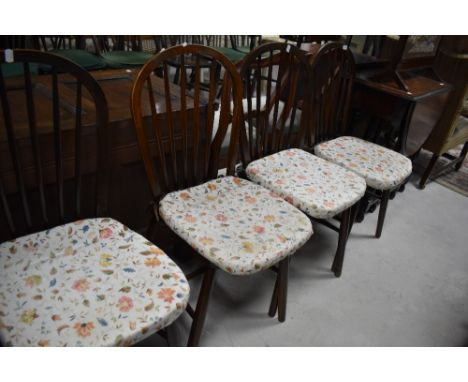 A set of four dark stained hoop and stick back kitchen chairs (probably Ercol)