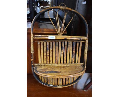A vintage bamboo wall shelf