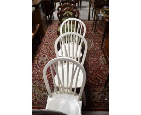 A set of three painted hoop and stick back kitchen chairs