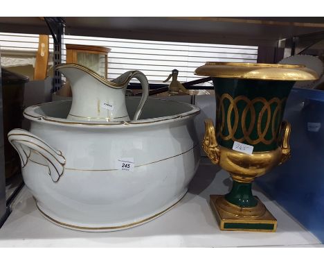 A large white ceramic basin with handles and gilt decoration to rim with a matching ewer, another basin decorated with roses 