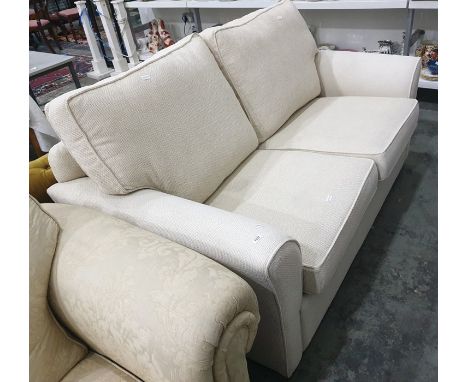 A two-seat cream-coloured upholstered sofa bed Condition ReportThe length is 170 cm.
