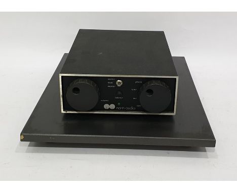 Naim audio pre-amplifier on Mission ISO Plat with cables Condition ReportWE believe it is NAC62 as it has five outlets, no nu