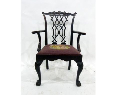 18th century carver chair in the manner of Chippendale, the carved and shaped toprail above the intricate fretwork carved bac