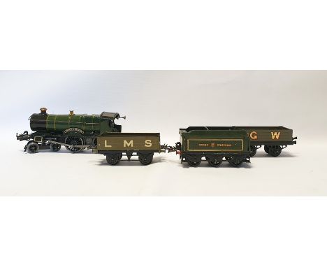 Hornby 0-gauge County of Bedford engine 3821 clockwork train, tender and two other trucks, with an original Hornby clockwork 