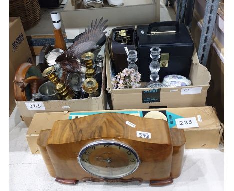 Two boxes of assorted household items to include brass candlesticks and a walnut clock, etc 