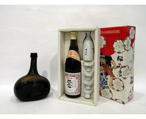 Antique bottle labelled "The Heirloom" blend scotch whiskey sole purveyors Rutherford and Kay Edinburgh London and Birmingham
