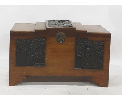 20th century Chinese camphorwood lined blanket chest, the stepped top with carved central panel, the whole raised upon bracke