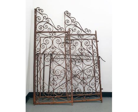 Pair of wrought iron garden gates with scroll decoration and a further gate (3) Condition ReportThe pair are 173 cm high and 