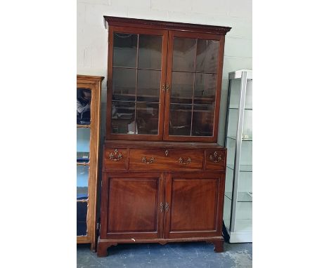 19th century mahogany secretaire library bookcase, the top with dentil cavetto cornice, fitted numerous shelves enclosed by g