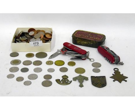 Third Reich German badge with swastika and eagle, two cap badges, pendant, sundry coins and two penknivesCondition ReportThe 