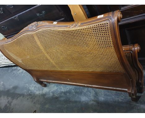A 20th century bed frame in the French manner, with caned head and footboardCondition ReportThere is some white paint on the 