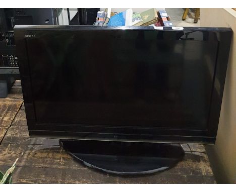 A Toshiba flatscreen television, 30" and&nbsp;a JVC video recorder and remote controls (2)&nbsp;  