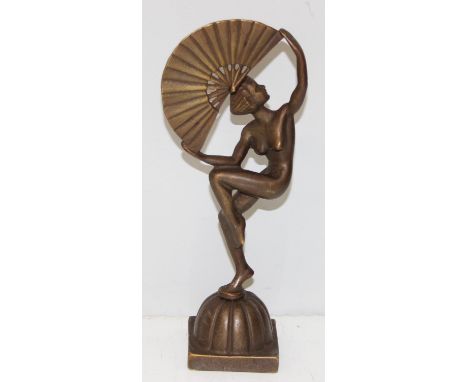 An Art Deco style figure of a nude lady with a fan, made from a bronze like copper alloy, 25cm tall