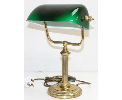 A vintage banker's desk lamp with green glass shade and brass column support, 36cm tall