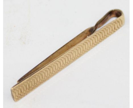 [3.54g] - a vintage 9ct gold tie clip with engine turned decoration, marked and XRF confirmed, 47mm wide