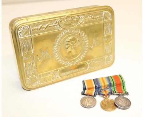 A First World War period Princess Mary tin and a set of WW1 &amp; WW2 miniature medals 