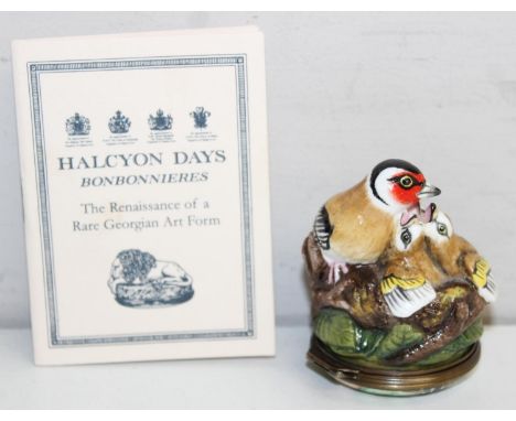 Halcyon Days enamels - an enamel and porcelain bonbonniere formed as a family of goldfinch, the base with a verse from Milton