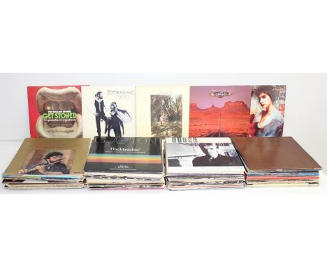A large qty of assorted vintage vinyl records, mainly LPs to inc Genesis, Eric Clapton, Queen, Bob Marley, Neil Diamond etc