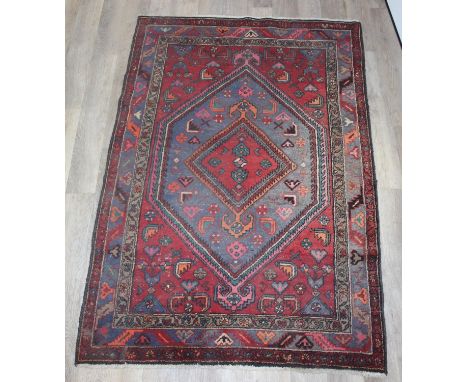 A large vintage Persian Hamadan rug of red and blue ground, 200cm x 132cm