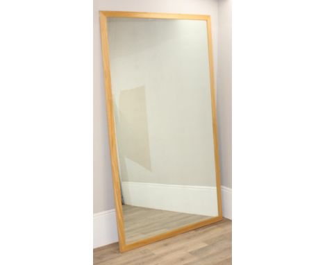 A very large light oak framed mirror, 225cm x 133cm