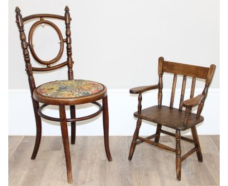 A Thonet style bentwood chair of unusual design with floral fabric cushion, and a small child's stained beech farmhouse style