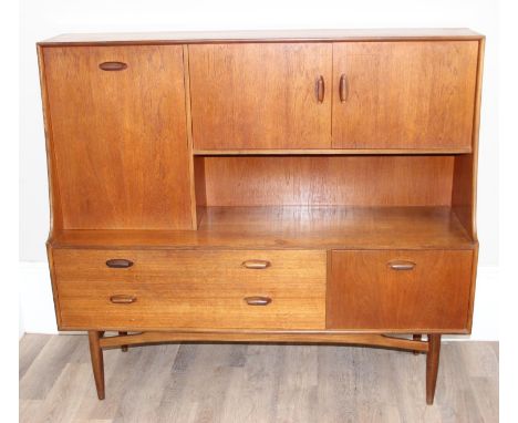 G-Plan - a retro E Gomme period teak wall unit or sideboard with fall-front drinks cabinet and double cupboard, over two grad