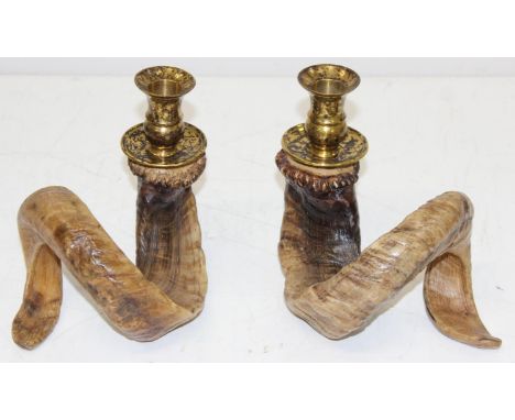 A pair of vintage rams horn and brass mounted candlesticks, each 17cm tall