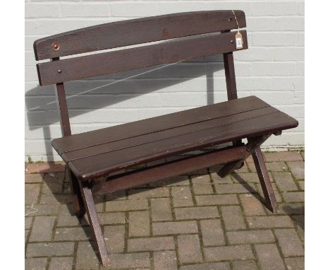 A good quality heavy stained hard wood 2 seater garden bench, 96cm wide x 82cm tall, one of four in the sale