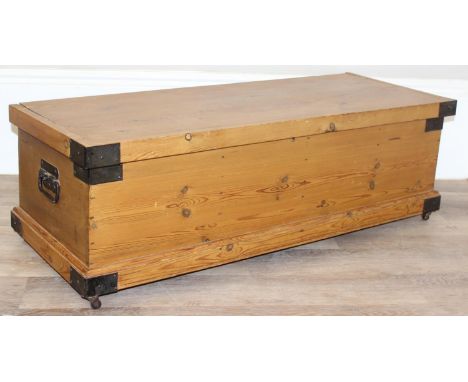 A vintage pine trunk with metal banding and handles, 115cm x 44cm x 88cm
